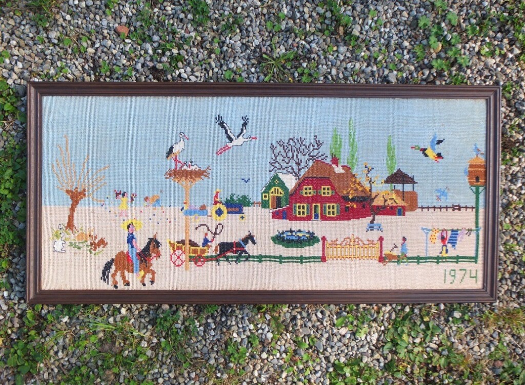 Geborduurd schilderij straattafereel