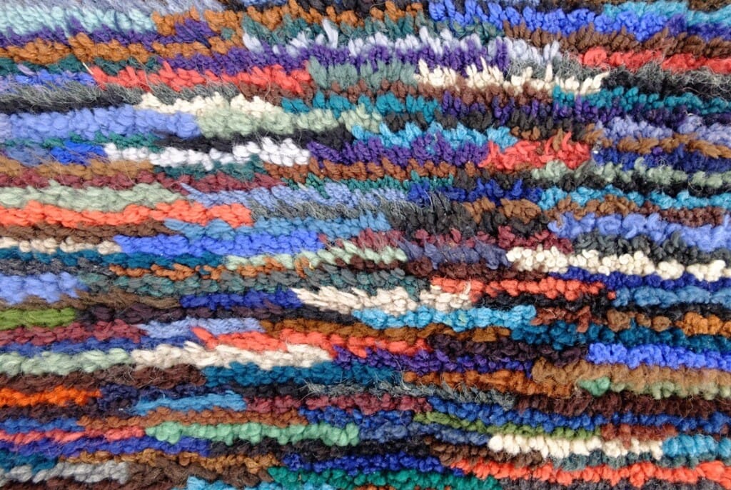 Detail smyrnakussen streepjes