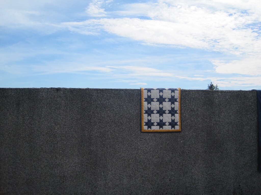 Quiltje Ohio star over betonnen muur