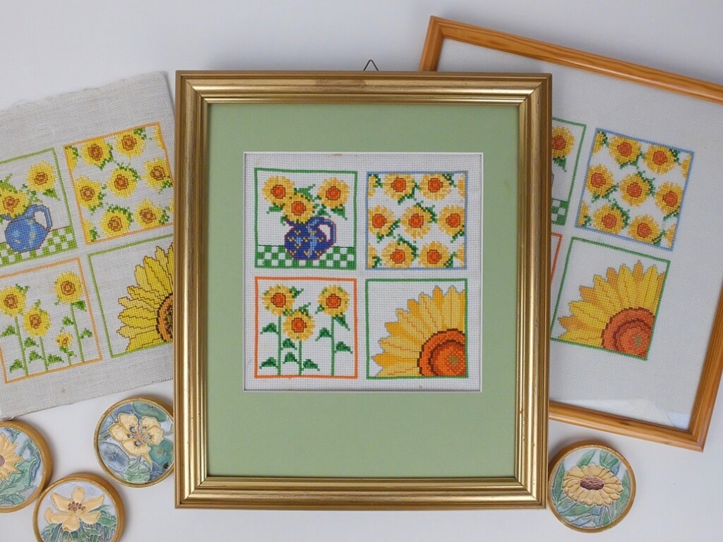 Drie borduurwerken zonnebloemen