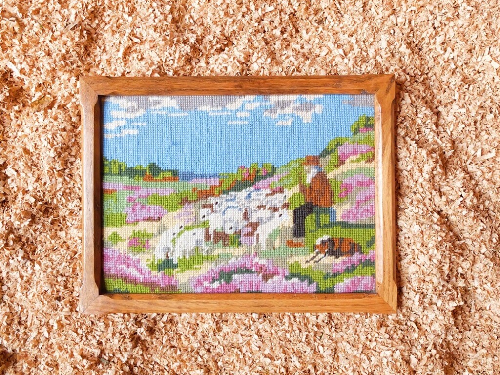 Borduurwerk herder met schapen